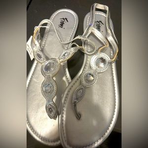 Silver sandals. Tag still on. Never been worn.
